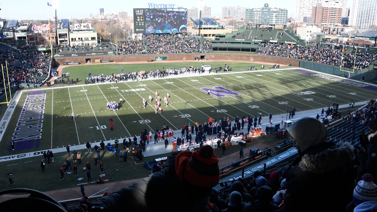 Why is Northwestern football playing Michigan at Wrigley Field?