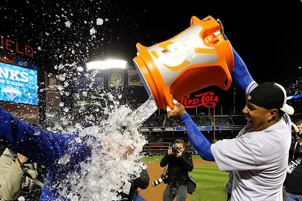 NEW YORK, NY – NOVEMBER 01: Salvador Perez #13 of the Kansas City Royals douses manager Ned Yost #3 of the Kansas City Royals after the Kansas City Royals defeat the New York Mets in Game Five of the 2015 World Series at Citi Field on November 1, 2015 in the Flushing neighborhood of the Queens borough of New York City. The Kansas City Royals defeated the New York Mets with a score of 7 to 2 to win the World Series. (Photo by Al Bello/Getty Images)