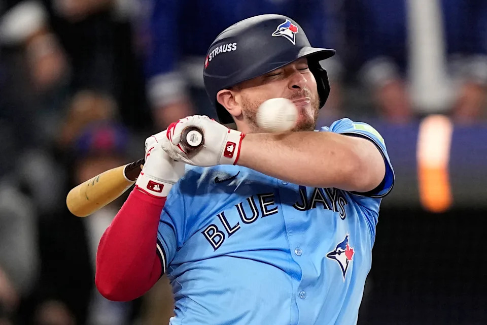 Toronto Blue Jays' Alejandro Kirk gets hit by a pitch against the Los Angeles Dodgers during the ninth inning in Game 6 of baseball's World Series, Friday, Oct. 31, 2025, in Toronto. (AP Photo/Brynn Anderson)
