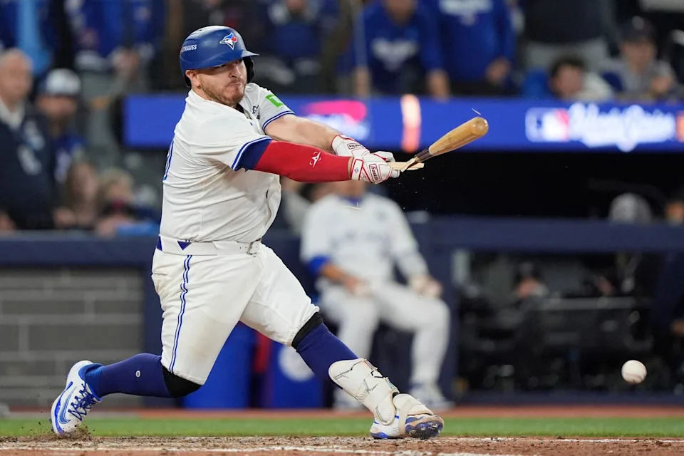Nov 1, 2025; Toronto, Ontario, CAN; Toronto Blue Jays catcher Alejandro Kirk (30) breaks his bat and hits into a double play in the eleventh inning against the Los Angeles Dodgers during game seven of the 2025 MLB World Series at Rogers Centre. Mandatory Credit: John E. Sokolowski-Imagn Images