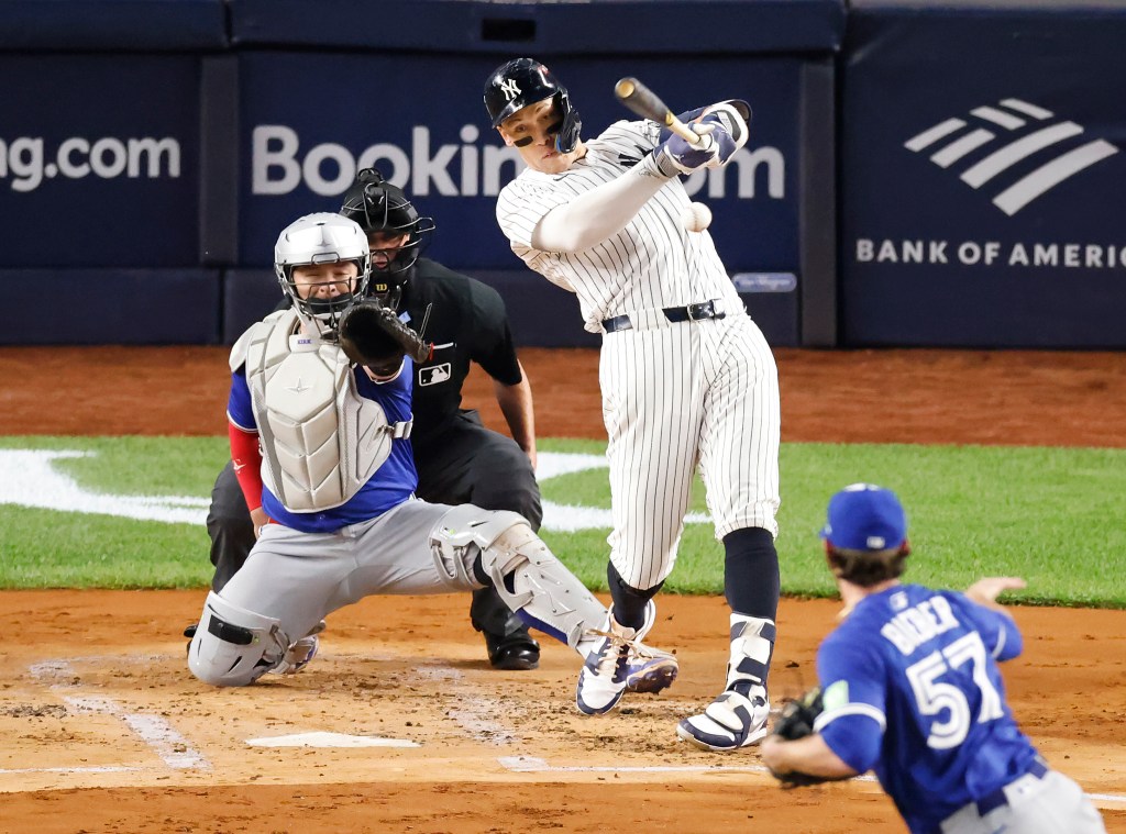 New York Yankees right fielder Aaron Judge (99) singles during the first inning when the New York Yankees played the Toronto Blue Jays in Game Three of their ALDS matchup Tuesday, October 7, 2025.