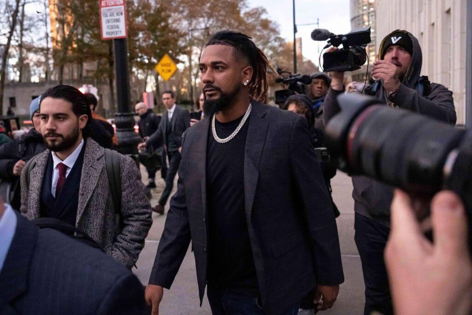 Cleveland Guardians pitcher Emmanuel Clase, center, leaves Brooklyn federal court in New York on Nov. 13, 2025.