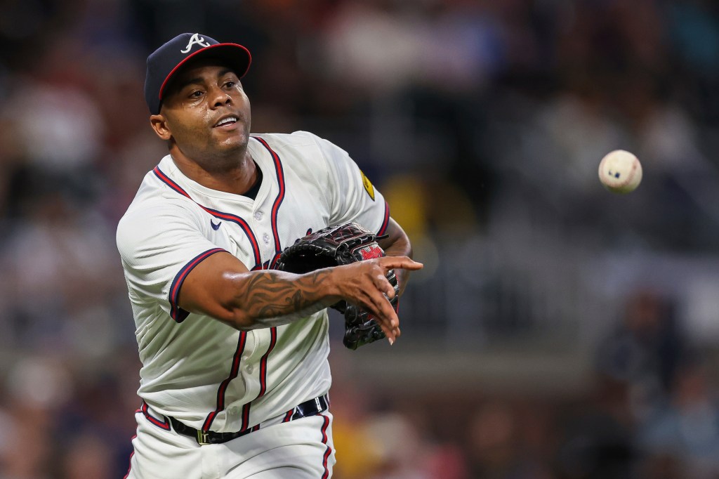 Atlanta Braves pitcher Raisel Iglesias throws to first base in the eighth inning of a baseball game against the Milwaukee Brewers, Aug. 6, 2025, in AtlantaAtlanta Braves pitcher Raisel Iglesias throws to first base in the eighth inning of a baseball game against the Milwaukee Brewers, Aug. 6, 2025, in Atlanta