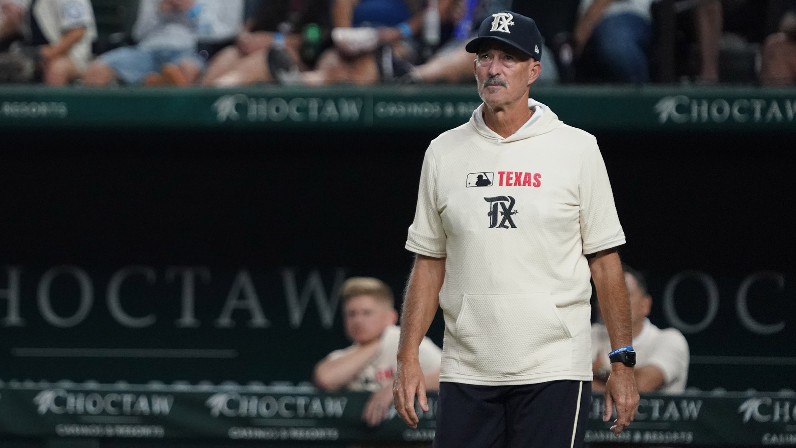 Texas Rangers pitching coach Mike Maddux (31) walks to the mound to visit with the pitcher during the seventh inning against the Cleveland Guardians at Globe Life Field.