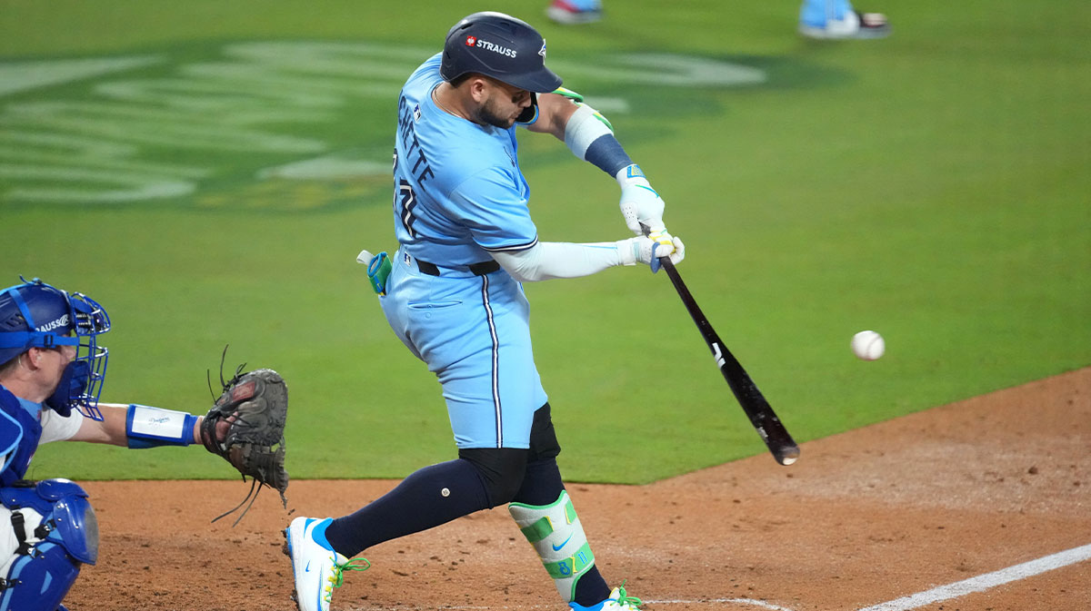 Toronto Blue Jays second baseman Bo Bichette (11) hits an RBI single against the Los Angeles Dodgers in the seventh inning during game five of the 2025 MLB World Series at Dodger Stadium.
