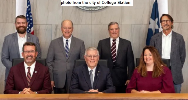 Photo from the city of College Station showing council members (L-R): William Wright, Bob Yancy, Mark Smith, John Nichols (mayor), David White, Melissa McIlhaney, and Scott Shafer.
