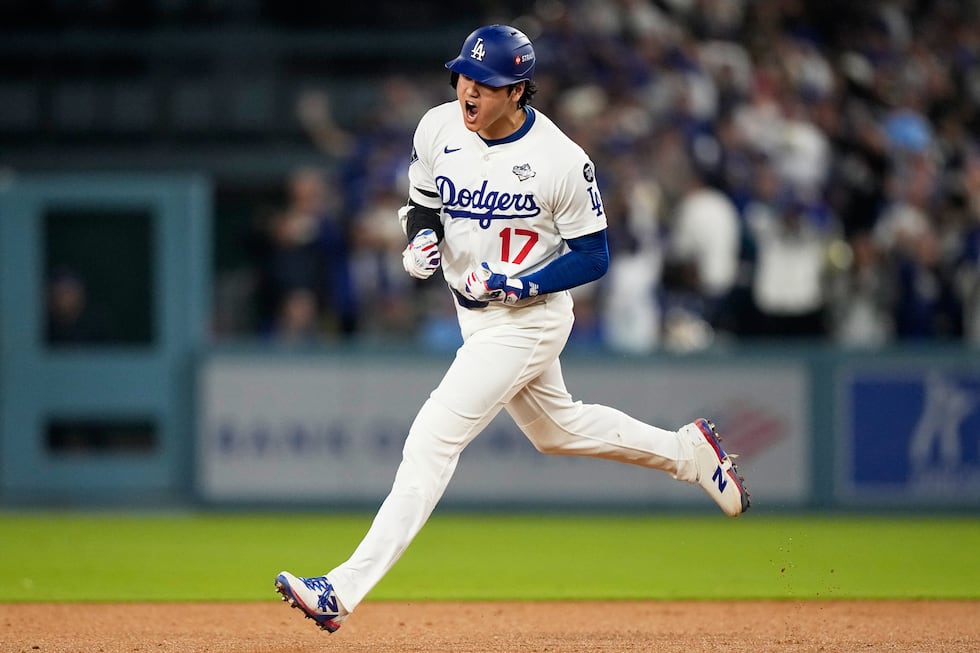 FILE - Los Angeles Dodgers' Shohei Ohtani celebrates his home run against the Toronto Blue...