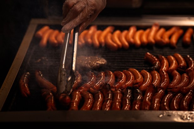 The grill at The Wieners Circle is full as the...