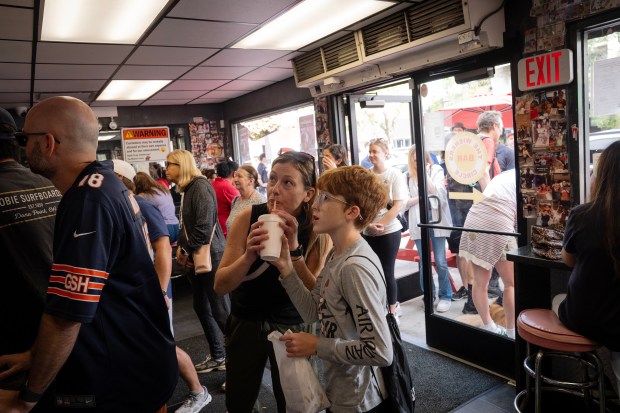 A crowd of Bears fans and hot dog fans mob...