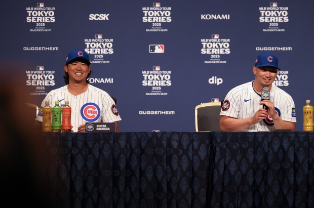 Cubs pitcher Shota Imanaga, left, and outfielder Seiya Suzuki answer...