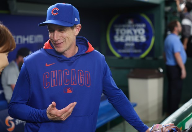 Cubs manager Craig Counsell talks with a reporter during a...
