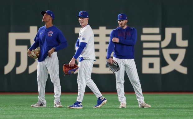 Cubs coach Quintin Berry, from left, and outfielders Pete Crow-Armstrong...