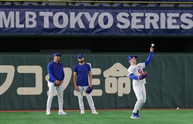 Cubs outfielder Pete Crow-Armstrong, right, works out on March 14,...