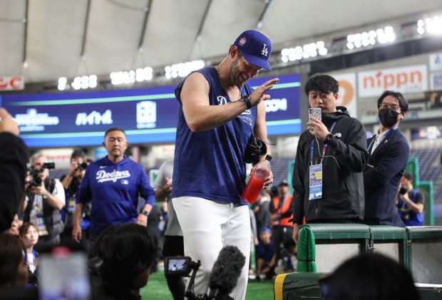 Dodgers pitcher Clayton Kershaw leaves the field after working out...