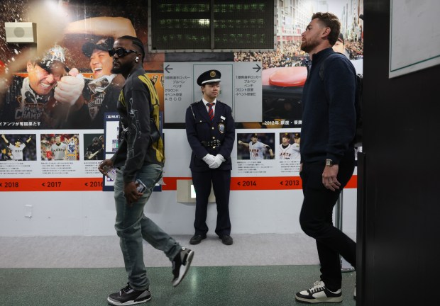 Cubs shortstop Vidal Bruján, left, and catcher Carson Kelly head...