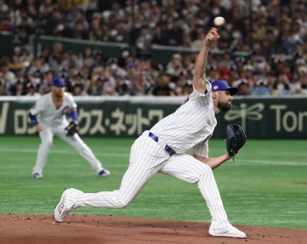 Cubs starting pitcher Julian Merryweather throws in the first inning...