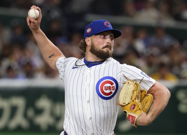 Cubs pitcher Porter Hodge throws against the Hanshin Tigers in...