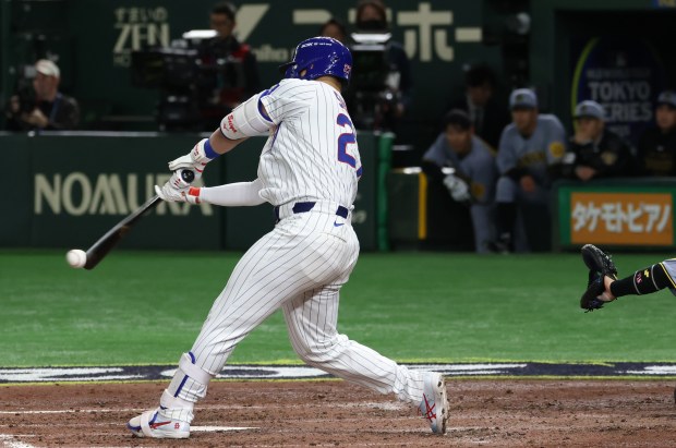 Cubs designated hitter Seiya Suzuki connects for a single against...