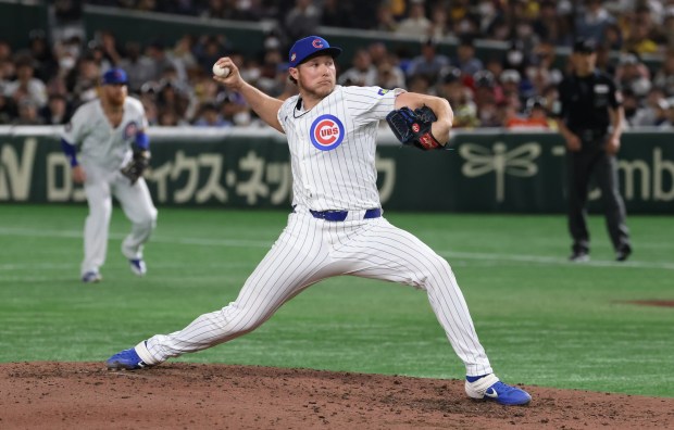 Cubs pitcher Nate Pearson throws against the Hanshin Tigers in...