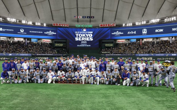 Hanshin Tigers catcher Ryutaro Umeno (2), right, is the last...