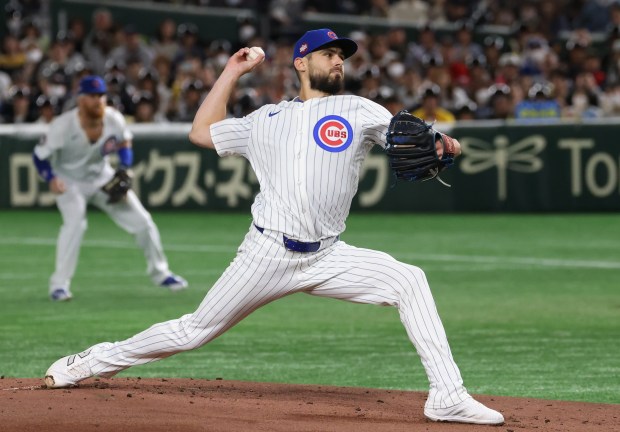 Cubs starting pitcher Julian Merryweather throws in the first inning...