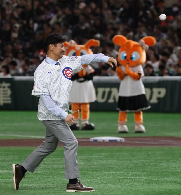 Former Japanese professional player and Cubs pitcher Hisanori Takahashi throws...