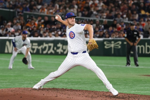 Cubs pitcher Jameson Taillon throws against the Yomiuri Giants in...