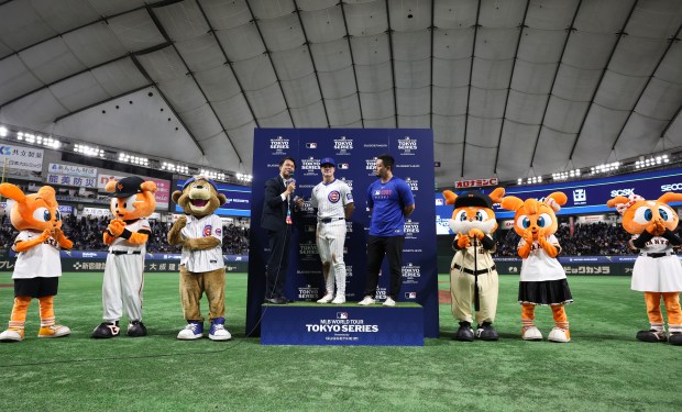Cubs third baseman Matt Shaw, center, is interviewed on the...