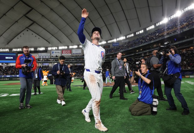 Cubs third baseman Matt Shaw waves to fans after a...