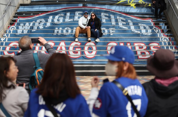 Angel Ortega and Savannah Crespo, from Roscoe Village neighborhood, sit...