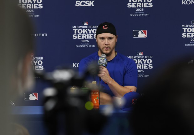 Cubs pitcher Justin Steele answers reporters' questions before the opening...