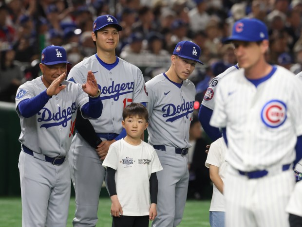 Dodgers manager Dave Roberts, left, and designated hitter Shohei Ohtani...