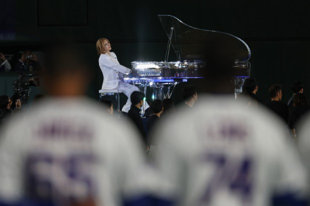 Musician Yoshiki performs the American and Japanese national anthems before...