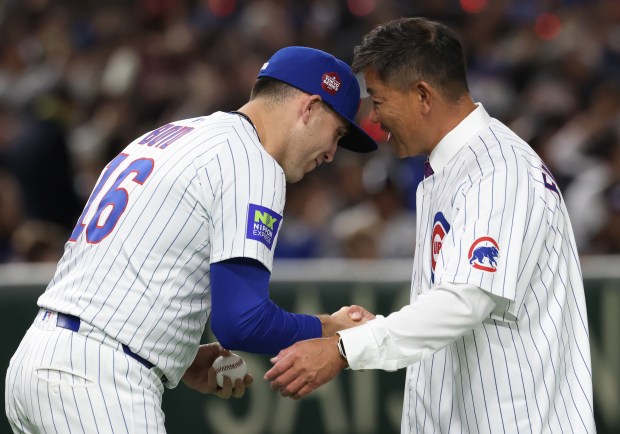 Cubs pitcher Matthew Boyd, left, greets retired outfielder Kosuke Fukudome...