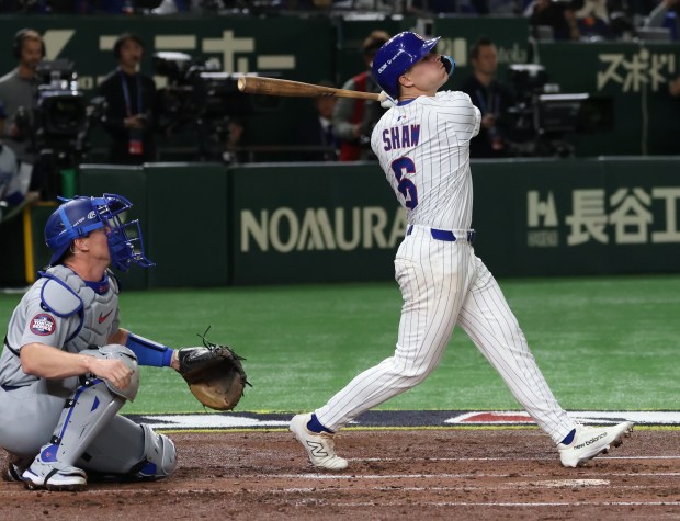 Cubs third baseman Matt Shaw swings for a strike in...