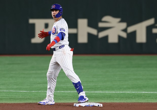 Cubs catcher Miguel Amaya celebrates after hitting an RBI double...