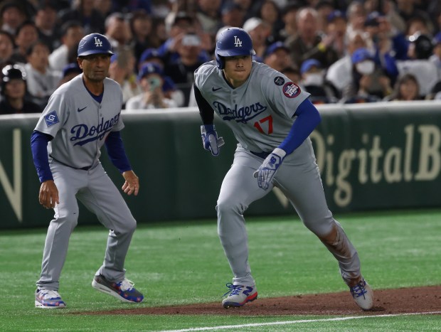 Dodgers designated hitter Shohei Ohtani (17) heads for home on...
