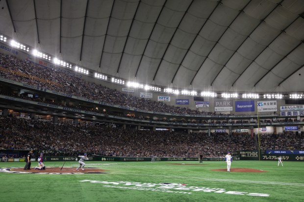 Dodgers designated hitter Shohei Ohtani runs on a double in...