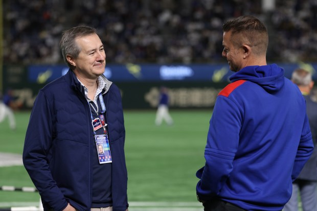 Cubs Chairman and co-owner Tom Ricketts, left, talks with medical...