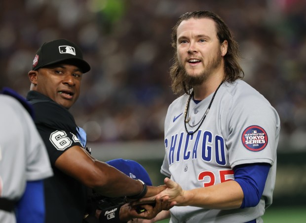 Cubs starting pitcher Justin Steele has his pitching equipment checked...