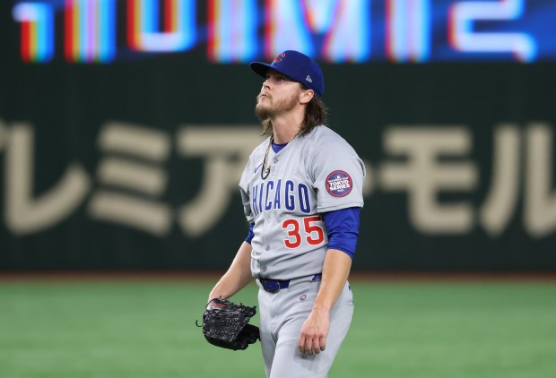 Cubs starter Justin Steele waits after giving up a home...