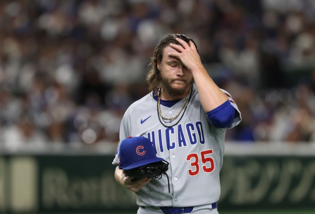 Cubs starting pitcher Justin Steele heads to the dugout after...