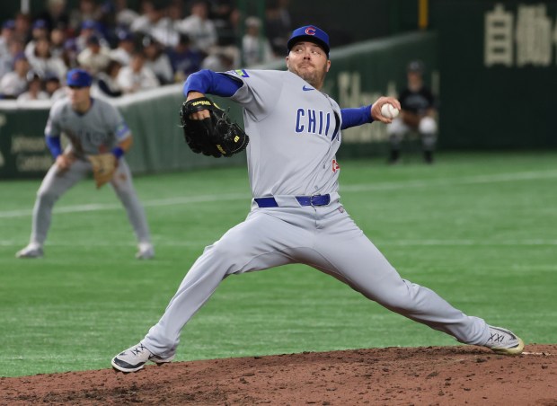 Cubs pitcher Caleb Thielbar throws against the Dodgers in the...