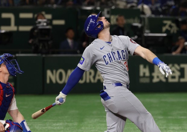 Cubs right fielder Kyle Tucker watches his popup in the...
