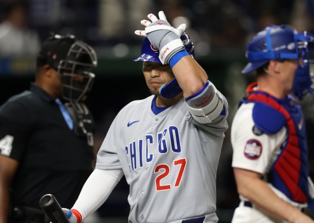 Cubs designated hitter Seiya Suzuki (27) heads to the dugout...