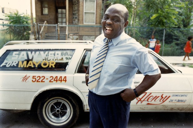 Ald. William Henry, 24th, with his car near Independence Square Fountain in Chicago on Aug. 18, 1988. (Chris Walker/Chicago Tribune)