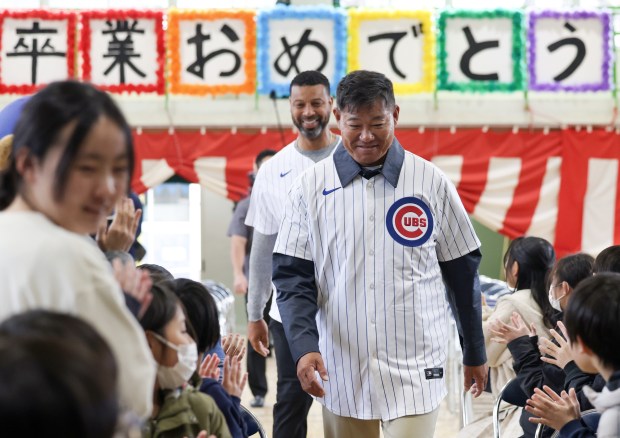 Former Cubs players Kosuke Fukudome, right, and Derrek Lee are...