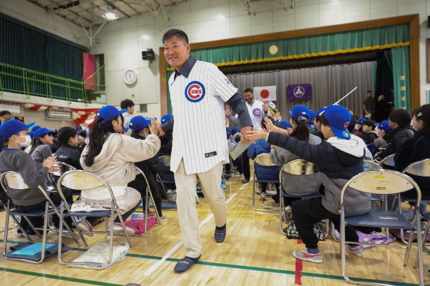 Former Cubs players Kosuke Fukudome and Derrek Lee exit after...