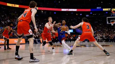 Mar 24, 2025; Denver, Colorado, USA; Denver Nuggets forward Peyton Watson (8) drives to the basket against Chicago Bulls guard Kevin Huerter (13) and guard Josh Giddey (3) as forward Matas Buzelis (14) defends in the third quarter at Ball Arena.