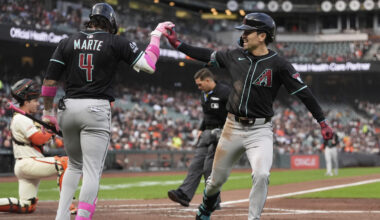 Arizona Diamondbacks' Corbin Carroll, right, is congratulated by Ketel Marte, silver sluggers...